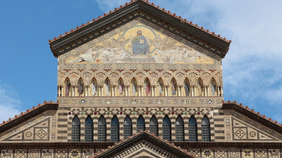 The striped and mosaic-covered facade gable of the Cathedral of Sant’Andrea in Amalfi