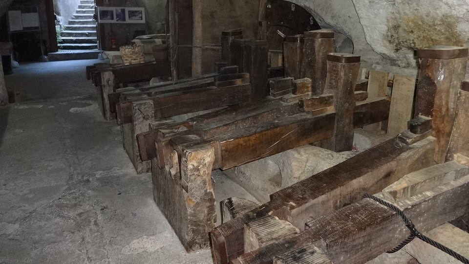 Wooden presses and vats inside the old paper mill of the Amalfi Paper Museum