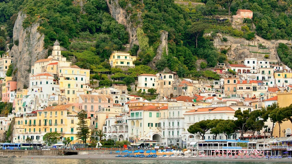 Amalfi town and its cathedral seen from a boat offshore