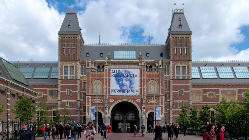 The red brick south facade of the Rijksmuseum in Amsterdam, with its twin towers and the passage beneath the building