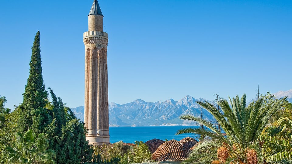 Fluted Yivli Minaret rising above Antalya rooftops