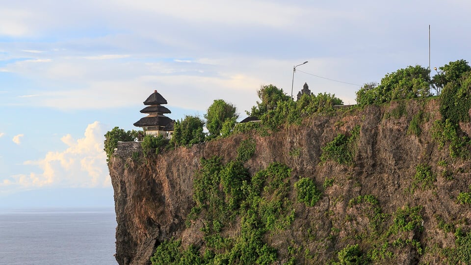 Uluwatu temple on the cliff above the sea