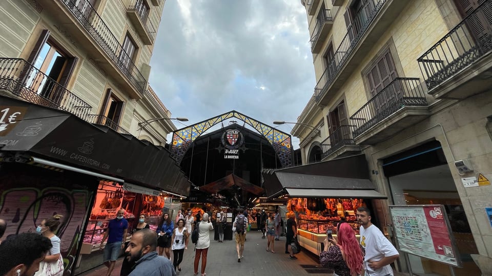 The iron and glass entrance arch of La Boqueria market off La Rambla in Barcelona