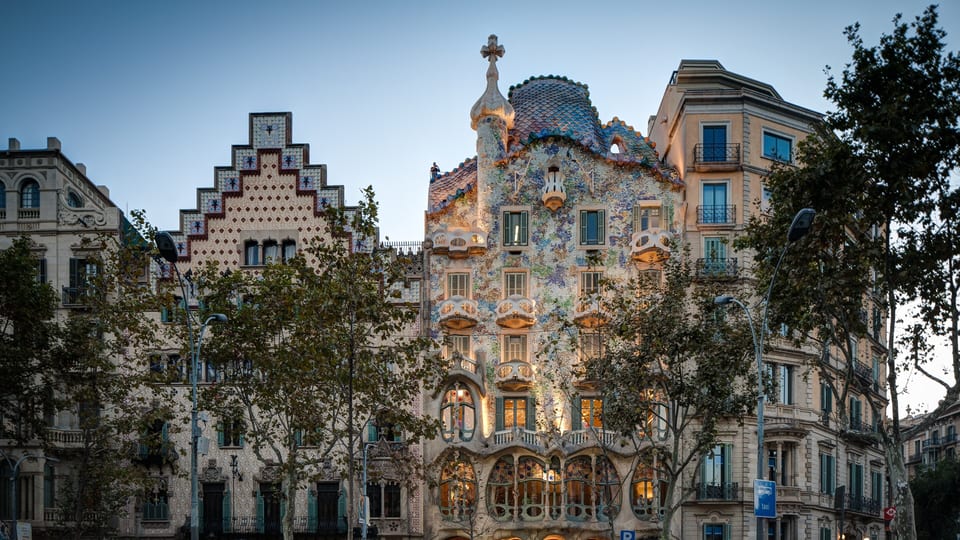 Casa Batlló's tiled facade beside Casa Amatller on Passeig de Gràcia in Barcelona