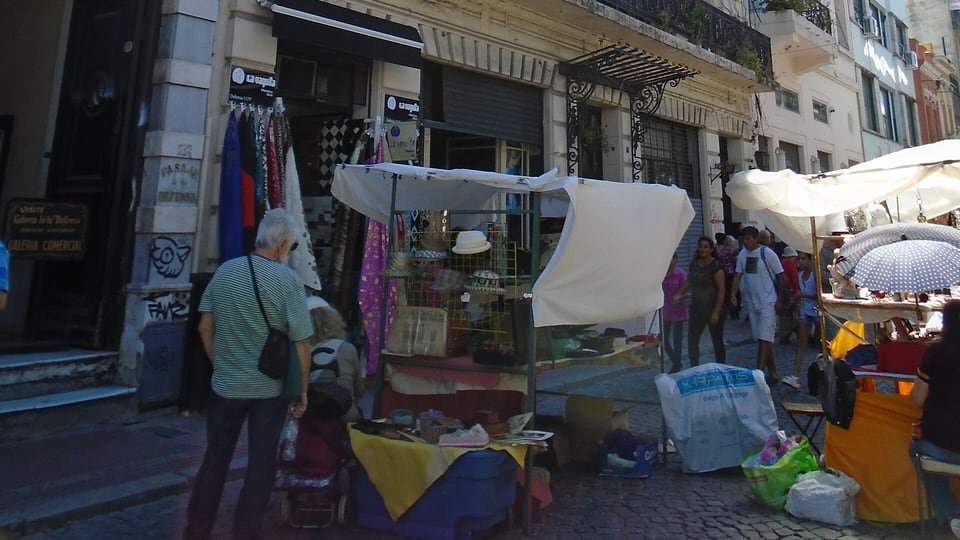 Stalls of the Sunday Feria de San Telmo along a San Telmo street