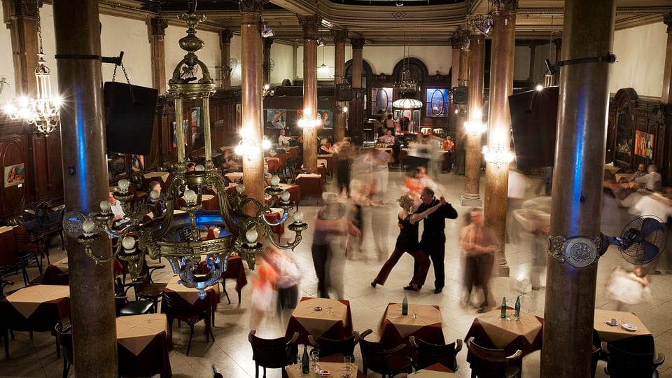 Couples dancing in a classic tango ballroom in Buenos Aires