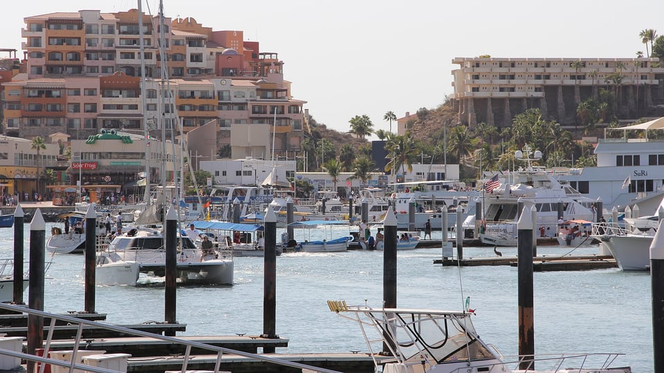 Boats and waterfront buildings around Cabo San Lucas marina