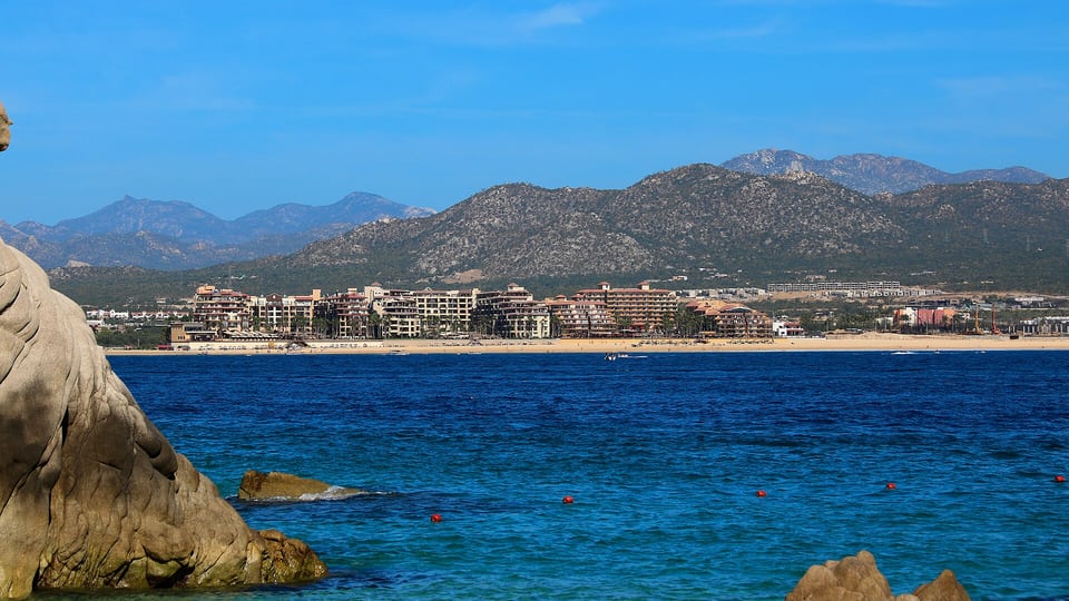 Médano Beach and the hotels along Cabo San Lucas bay, seen from the rocks at Land's End