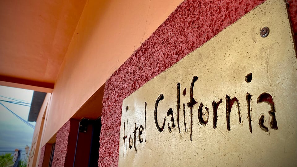 The painted Hotel California sign on the hotel wall in Todos Santos