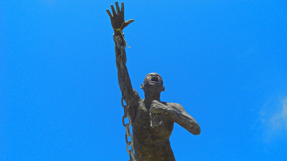 The statue of Benkos Biohó breaking his chains in San Basilio de Palenque