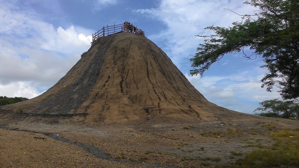 The cone of the El Totumo mud volcano with its wooden staircase and viewing platform
