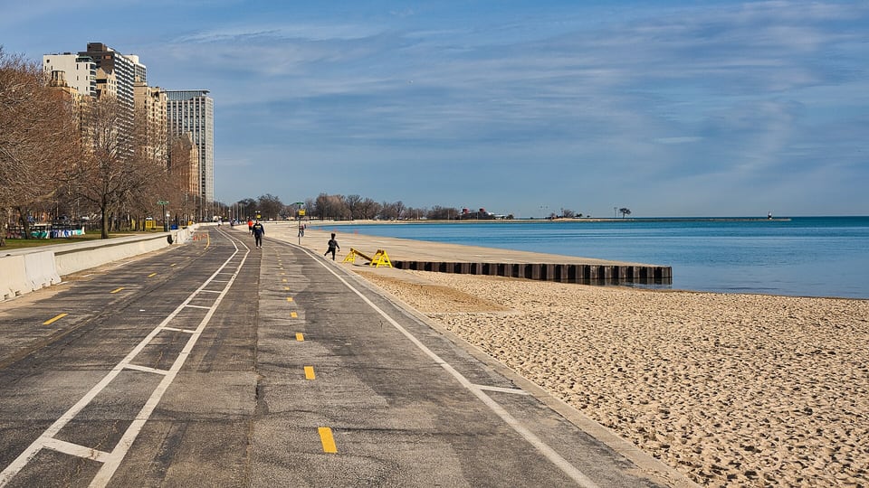 Lakefront Trail and a sandy beach beside Lake Michigan near Oak Street