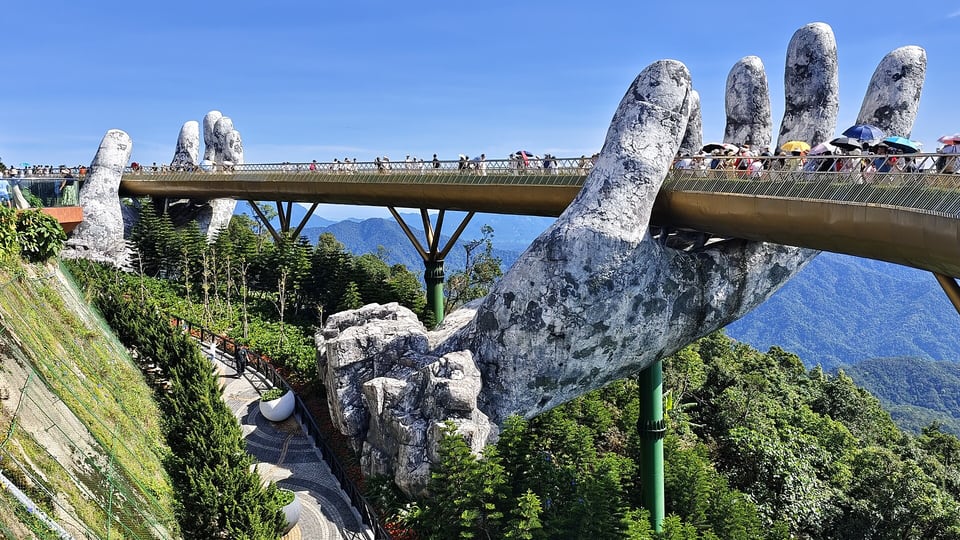 The Golden Bridge held up by two giant sculpted hands at Ba Na Hills, Da Nang