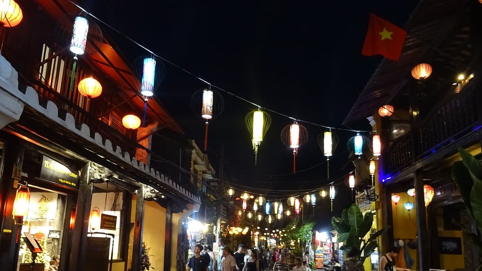 Silk lanterns strung across a street in Hoi An old town at night