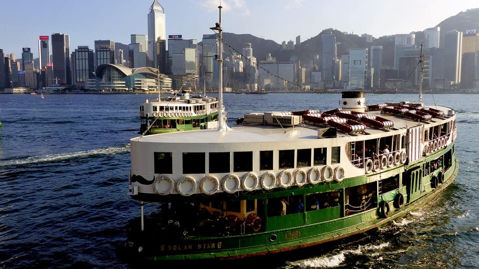 The Star Ferry Solar Star crossing Victoria Harbour towards the Central skyline