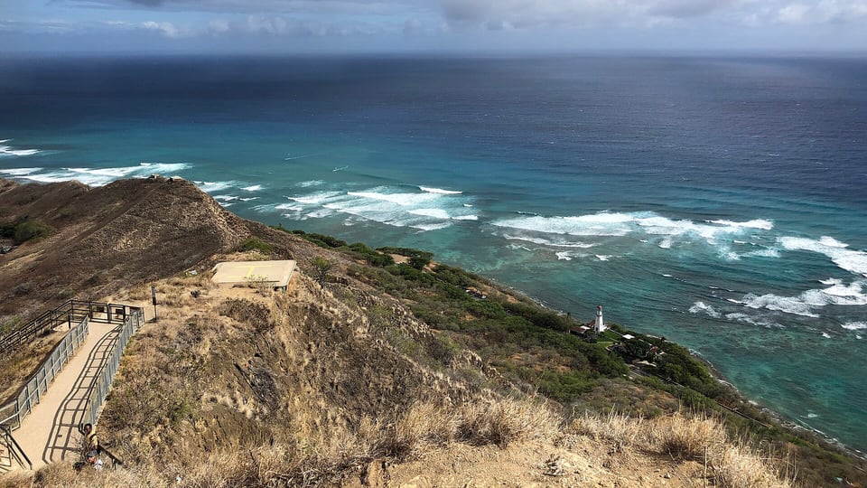 The walkway along the Diamond Head summit ridge above the surf of the south shore