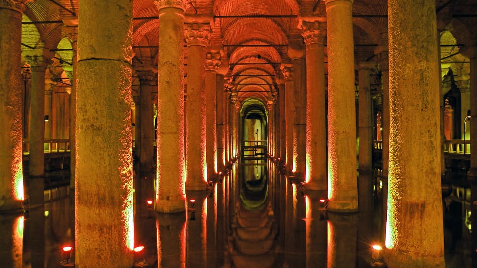 Rows of lit columns reflected in the water of the Basilica Cistern, Istanbul