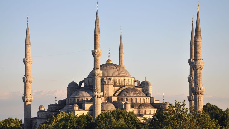 The cascading domes and minarets of the Sultan Ahmed (Blue) Mosque in evening light
