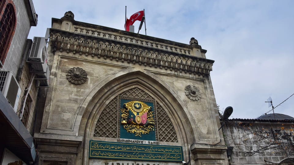 The stone entrance gate of the Grand Bazaar in Istanbul with the Ottoman coat of arms