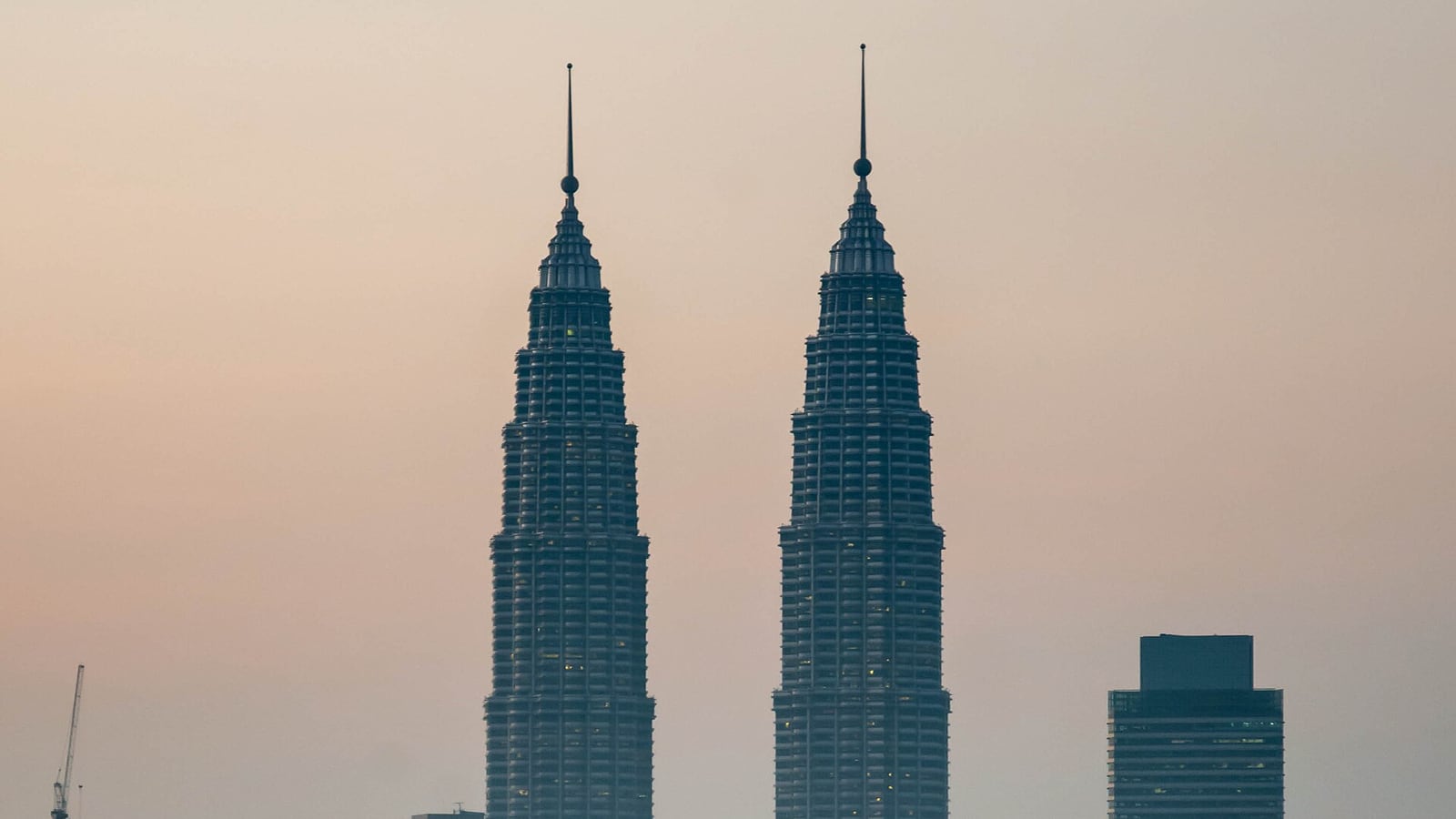 The PETRONAS Twin Towers rising above the KLCC precinct in Kuala Lumpur, the timed ticket that sets the order of this day
