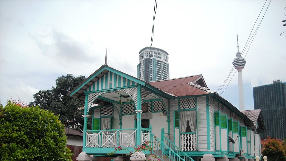 Traditional homes and modern towers in Kampung Baru