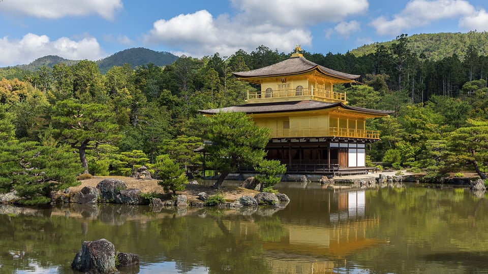 The gold-leafed Kinkaku-ji pavilion reflected in its mirror pond