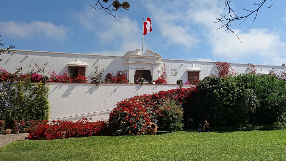 The white colonial building and flower gardens of Museo Larco in Pueblo Libre, Lima