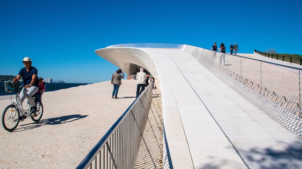 The curved, tiled roof walkway of the MAAT museum beside the Tagus in Belém, Lisbon
