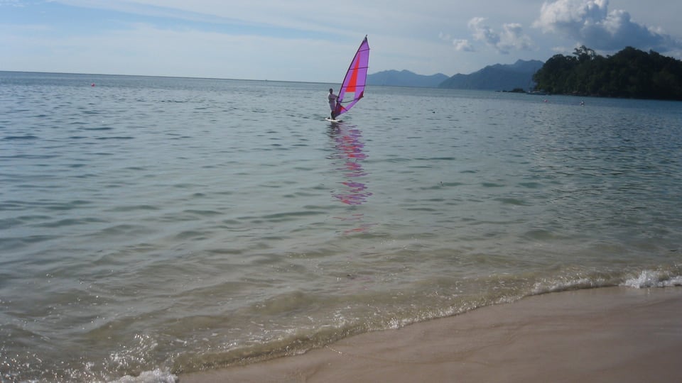 Forested coast and pale sand at Datai Beach in Langkawi