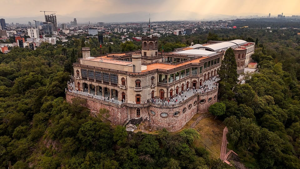 Aerial view of Chapultepec Castle on its hill above the surrounding forest