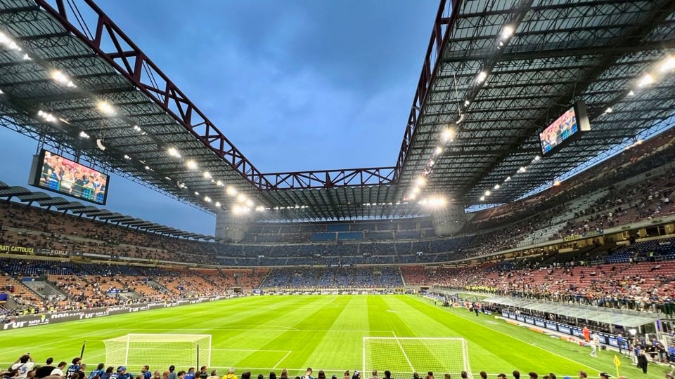 The football pitch and covered stands inside San Siro stadium in Milan
