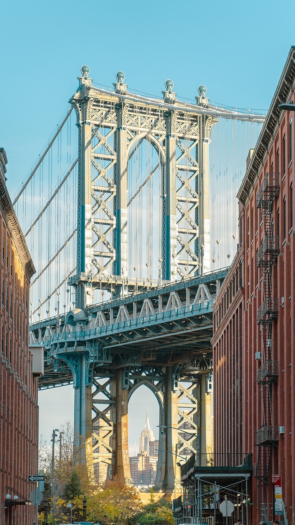 Manhattan Bridge framed by buildings in Dumbo, Brooklyn