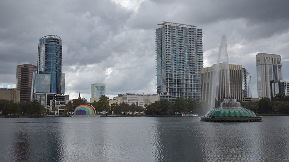 Lake Eola fountain and amphitheater with the downtown Orlando skyline