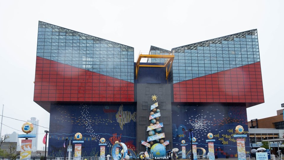 The colourful exterior of Osaka Aquarium Kaiyukan in the bay area