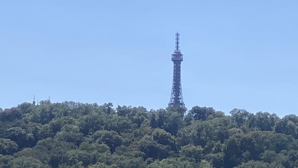Petřín Lookout Tower rising above the wooded slopes of Petřín Hill in Prague
