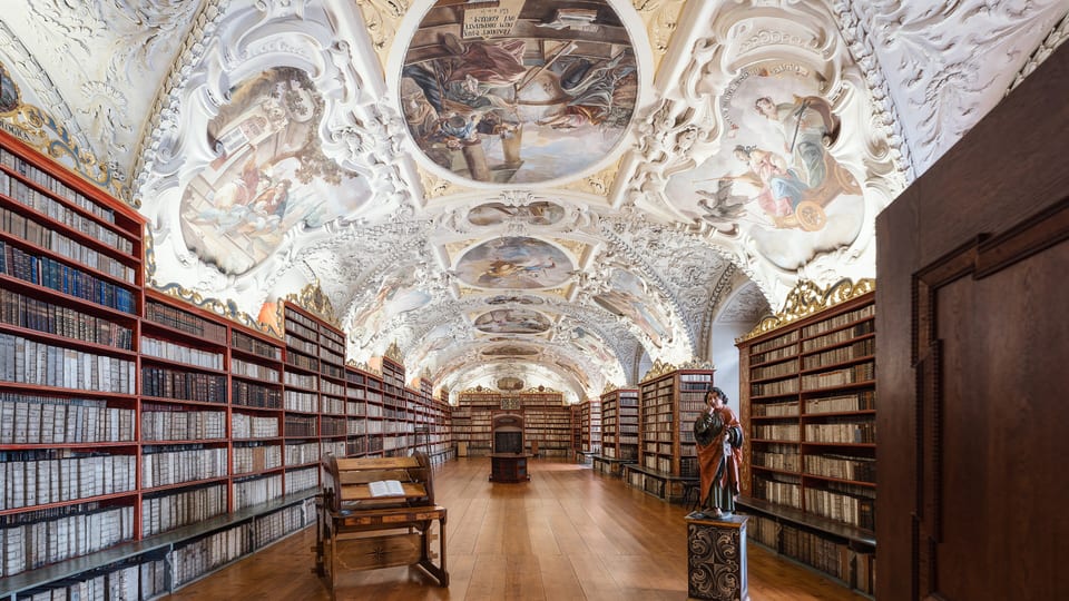 Baroque ceiling frescoes and bookcases in the Theological Hall of the Strahov Monastery Library in Prague