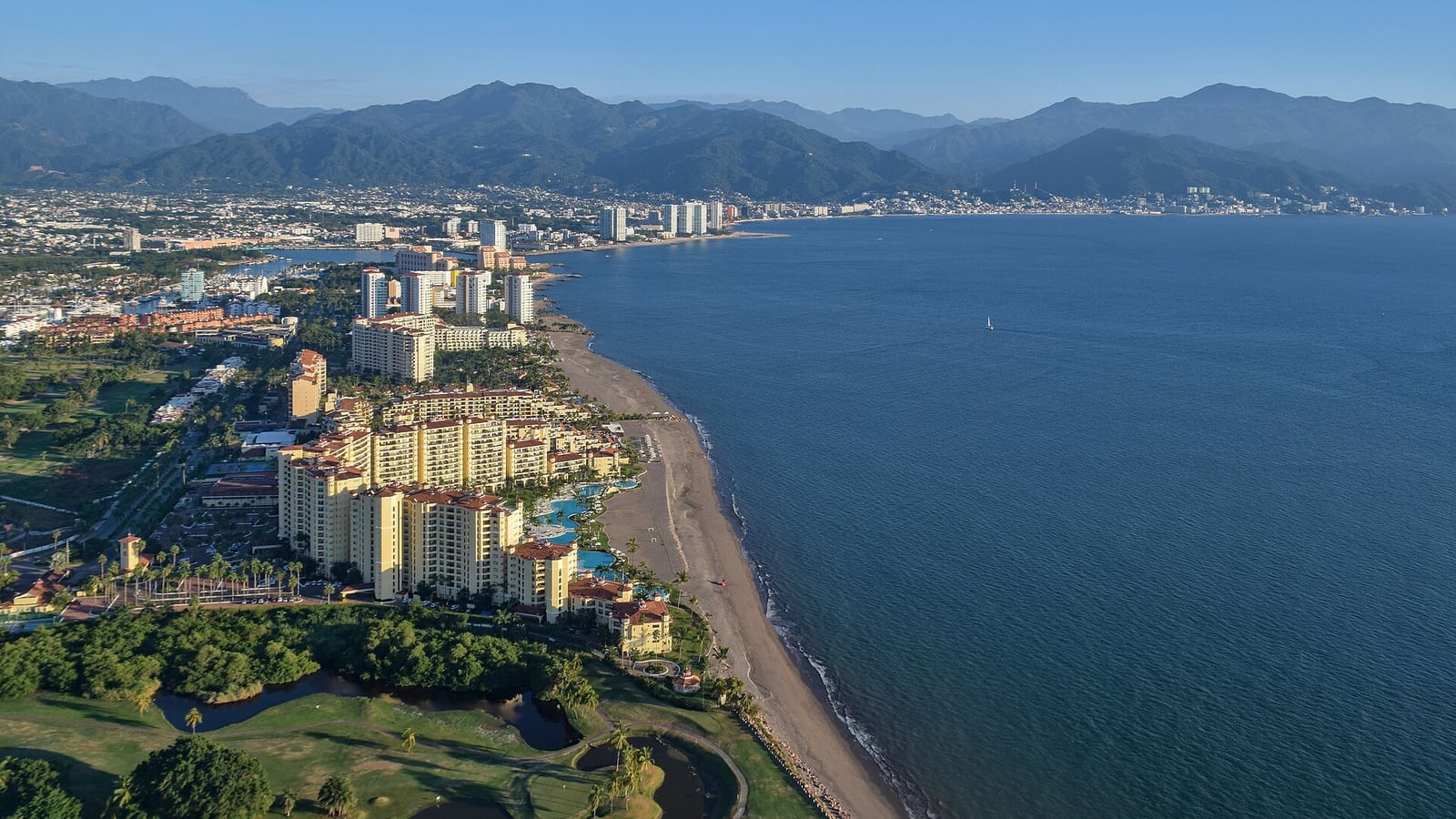 Puerto Vallarta's hotel-lined shore on Banderas Bay, with the Sierra Madre behind