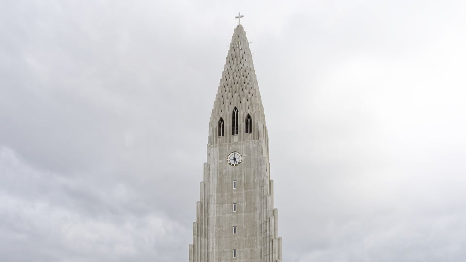Hallgrímskirkja’s concrete tower rising above central Reykjavík