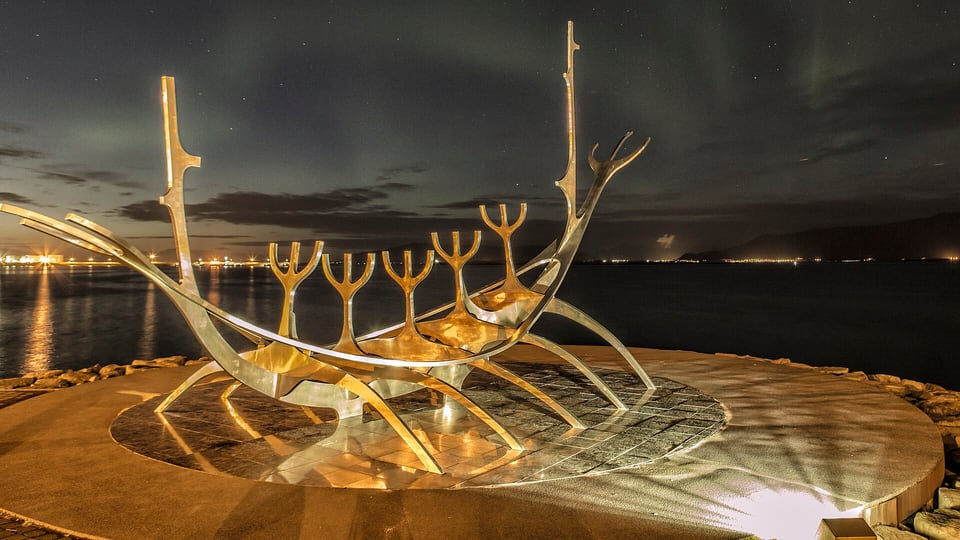 The Northern Lights over the Sun Voyager sculpture in central Reykjavík