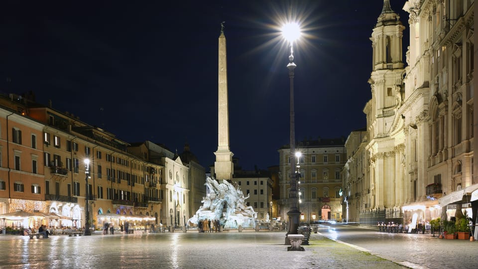 Piazza Navona in Rome at night, with the obelisk of the Fountain of the Four Rivers and the church of Sant'Agnese in Agone