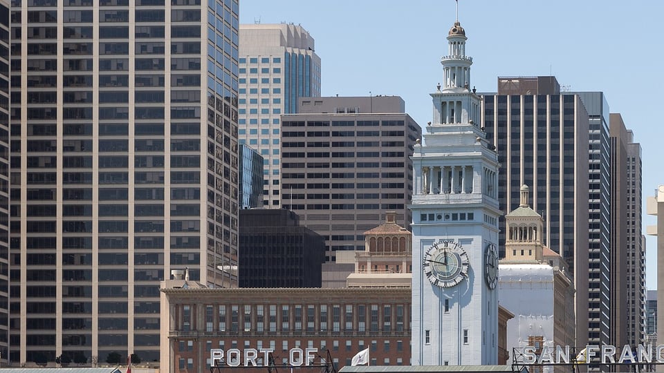 The Ferry Building clock tower among Financial District office towers