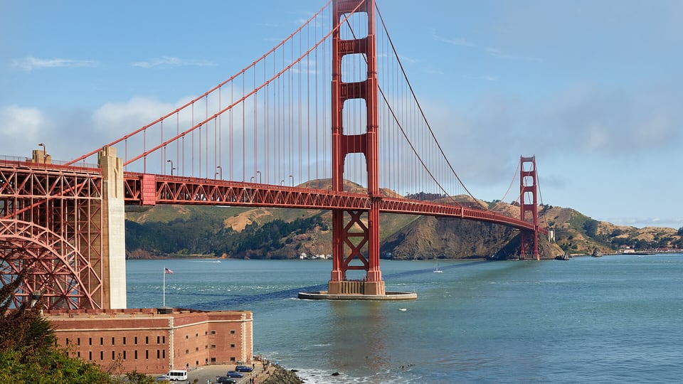 The Golden Gate Bridge and Fort Point seen from the Presidio shore