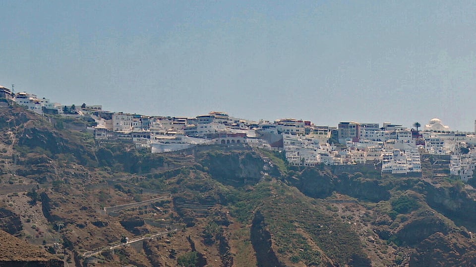 The Fira cable car descending toward the Old Port
