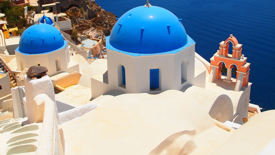 The blue-domed churches of Oia overlooking the caldera