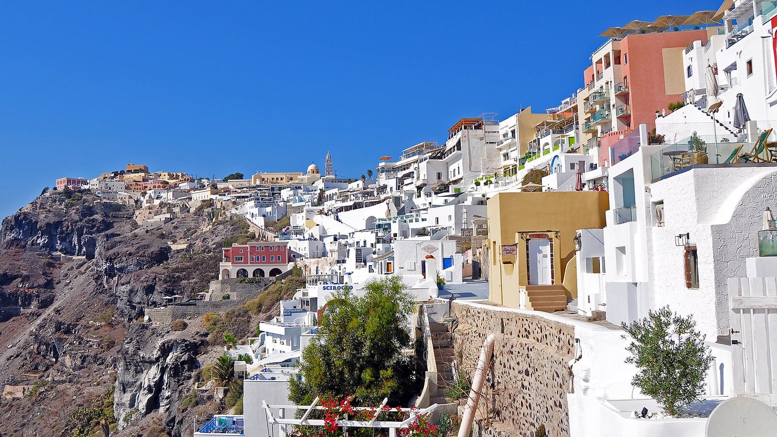 Whitewashed Fira and the Santorini caldera at sunset