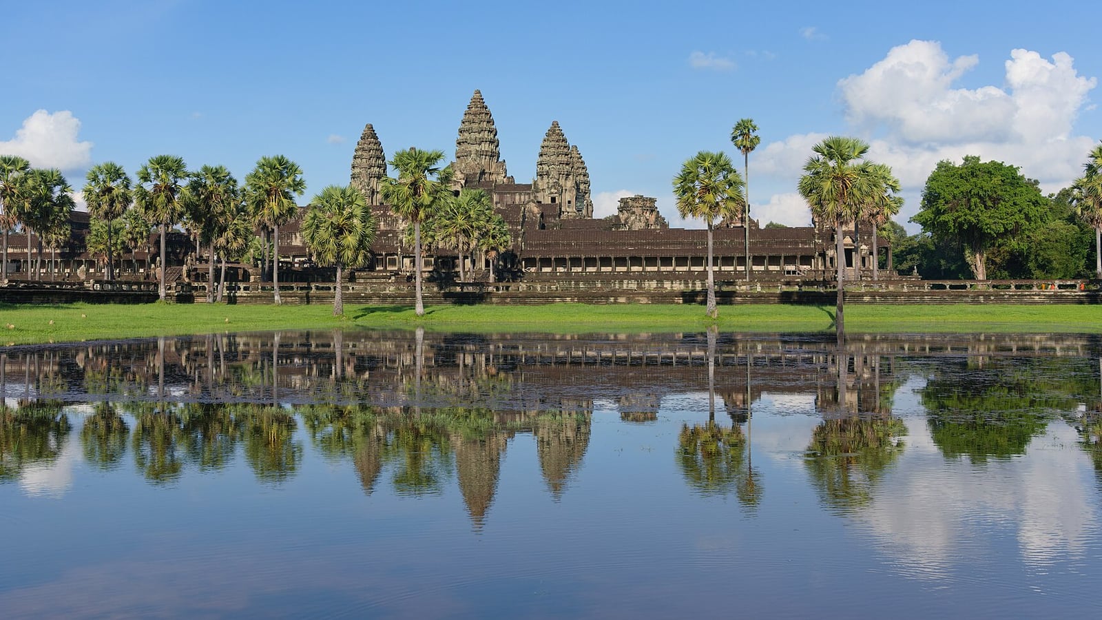 Angkor Wat reflected in its moat at sunrise