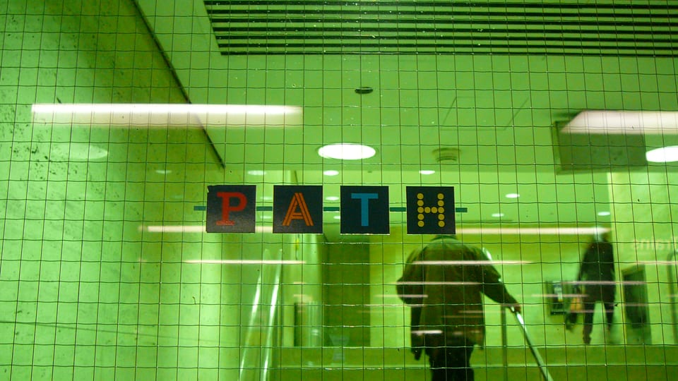 The PATH logo above a stairway entrance to Toronto's underground walkway network