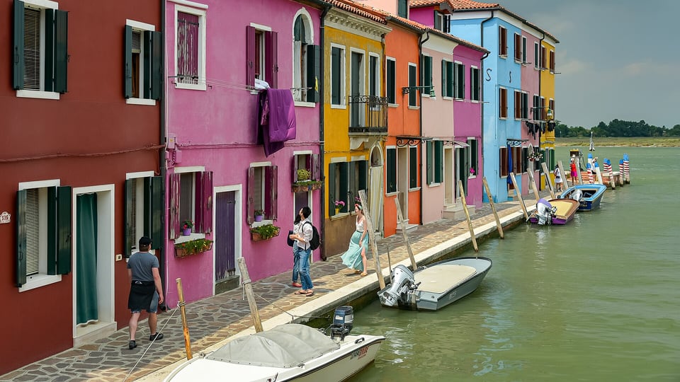 Brightly painted houses along a canal on Burano