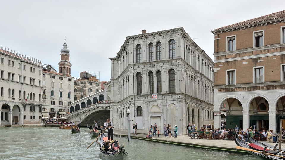 The Rialto Bridge and the Palazzo dei Camerlenghi from the Grand Canal with a gondola passing