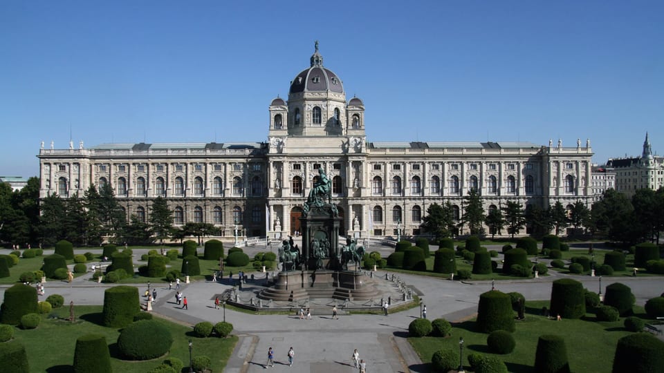 The domed Kunsthistorisches Museum in Vienna behind the Maria Theresa Monument and the gardens of Maria-Theresien-Platz